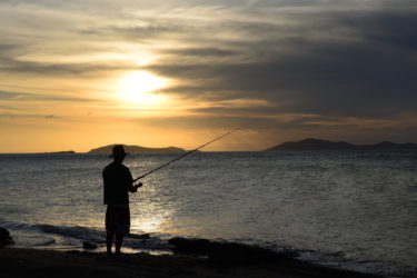 Fishing in the golden rays of sunset