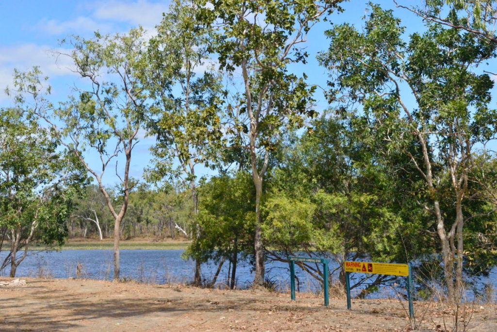Beware crocodiles sign at the lagoon where Doc is fishing